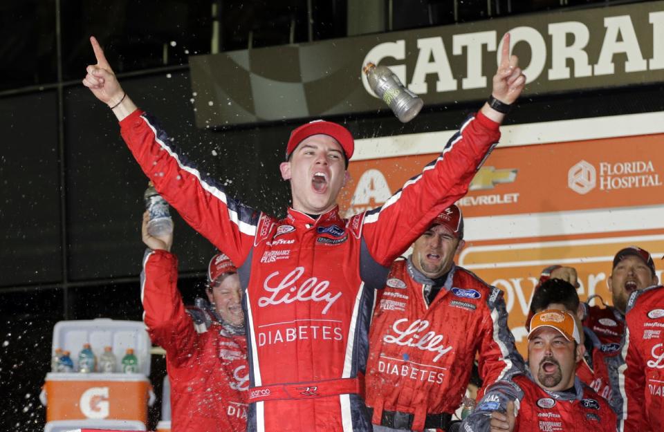 Ryan Reed celebrates in Victory Lane after winning the NASCAR Xfinity series auto race at Daytona International Speedway in Daytona Beach, Fla., Saturday, Feb. 25, 2017. (AP Photo/Terry Renna)