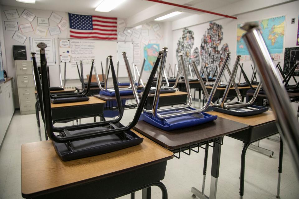 A classroom sits empty at the Cesar Chavez Academy High School in Detroit last March after the pandemic hit.