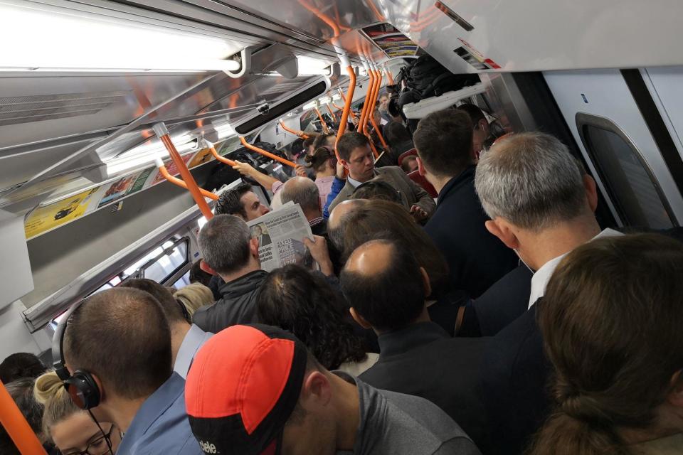 Commuters packed together on the 7.46am service between Woking and Waterloo. (@DanielP95084656)