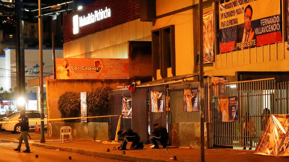 Security officials work at the rally site where Villavicencio was killed on Wednesday. - Karen Toro/Reuters