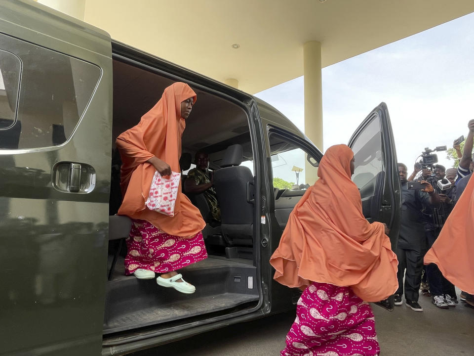 Freed students of the LEA Primary and Secondary School Kuriga, leave a van upon arrival at the government house in Kaduna, Nigeria, Monday, March 25, 2024. More than 130 children abducted more than two weeks ago from their school in Nigeria's northwestern state of Kaduna were rescued Sunday and are getting psychological support before being returned to their families, the West African nation’s military and government officials said. (AP Photo/Chinedu Asadu)