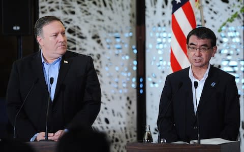 Taro Kono, Japan's foreign minister, right, speaks during a news conference with Mike Pompeo, U.S. secretary of state - Credit: Bloomberg