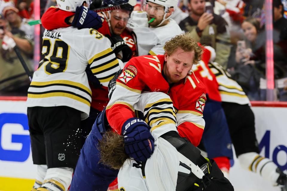 May 8, 2024; Sunrise, Florida, USA; Florida Panthers defenseman Niko Mikkola (77) and Boston Bruins defenseman Charlie McAvoy (73) fight during the third period in game two of the second round of the 2024 Stanley Cup Playoffs at Amerant Bank Arena. Mandatory Credit: Sam Navarro-USA TODAY Sports