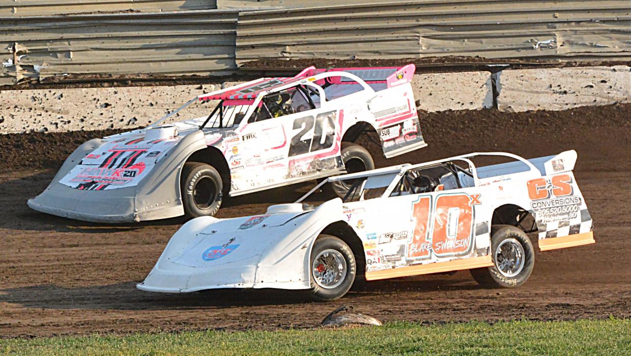 Trevor Anderson (20) and Blake Swenson (10X) of Watertown compete in a late model heat race at Casino Speedway on Sunday, July 16, 2023.