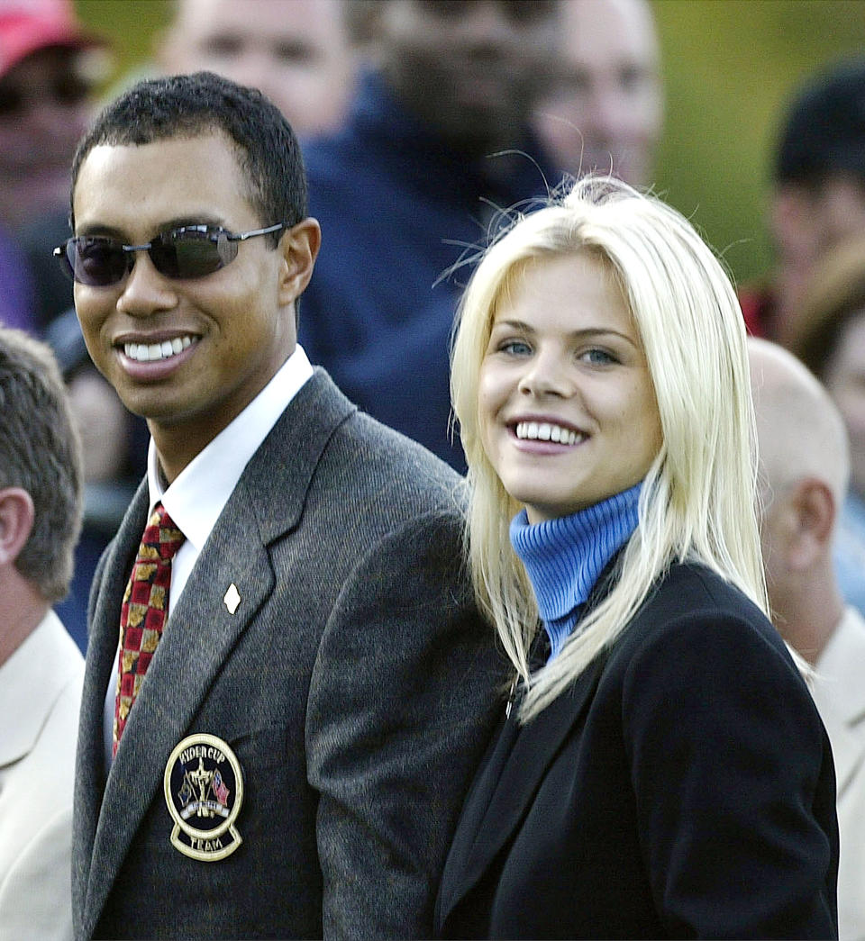 SUTTON COLDFIELD - SEPTEMBER 26:  Golfer Tiger Woods poses with girlfriend Elin Nordegren during the opening Ceremony for the 34th Ryder Cup on September 26, 2002 in Sutton Coldfield, England. (Photo by Andrew Redington/Getty Images)