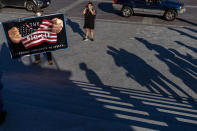 Stephen Parlato of Boulder, Colo., holds a sign that reads "The Big Lie, It's Poison Continues to Spread" outside the House Camber after the House voted to hold former White House Senior Adviser Steve Bannon in contempt of Congress for defying a subpoena from the committee investigating the violent Jan. 6 Capitol insurrection Thursday, Oct. 21, 2021, at the Capitol in Washington. (AP Photo/Andrew Harnik)