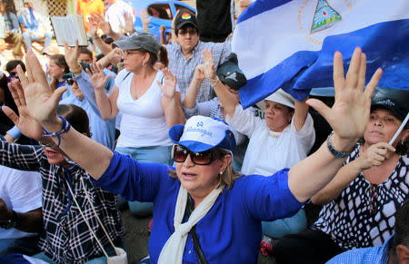 Demonstrators shouts slogans during a march to mark the one year anniversary of the protests against Nicaraguan President Daniel Ortega's government in Managua, Nicaragua April 17, 2019.REUTERS/Oswaldo Rivas