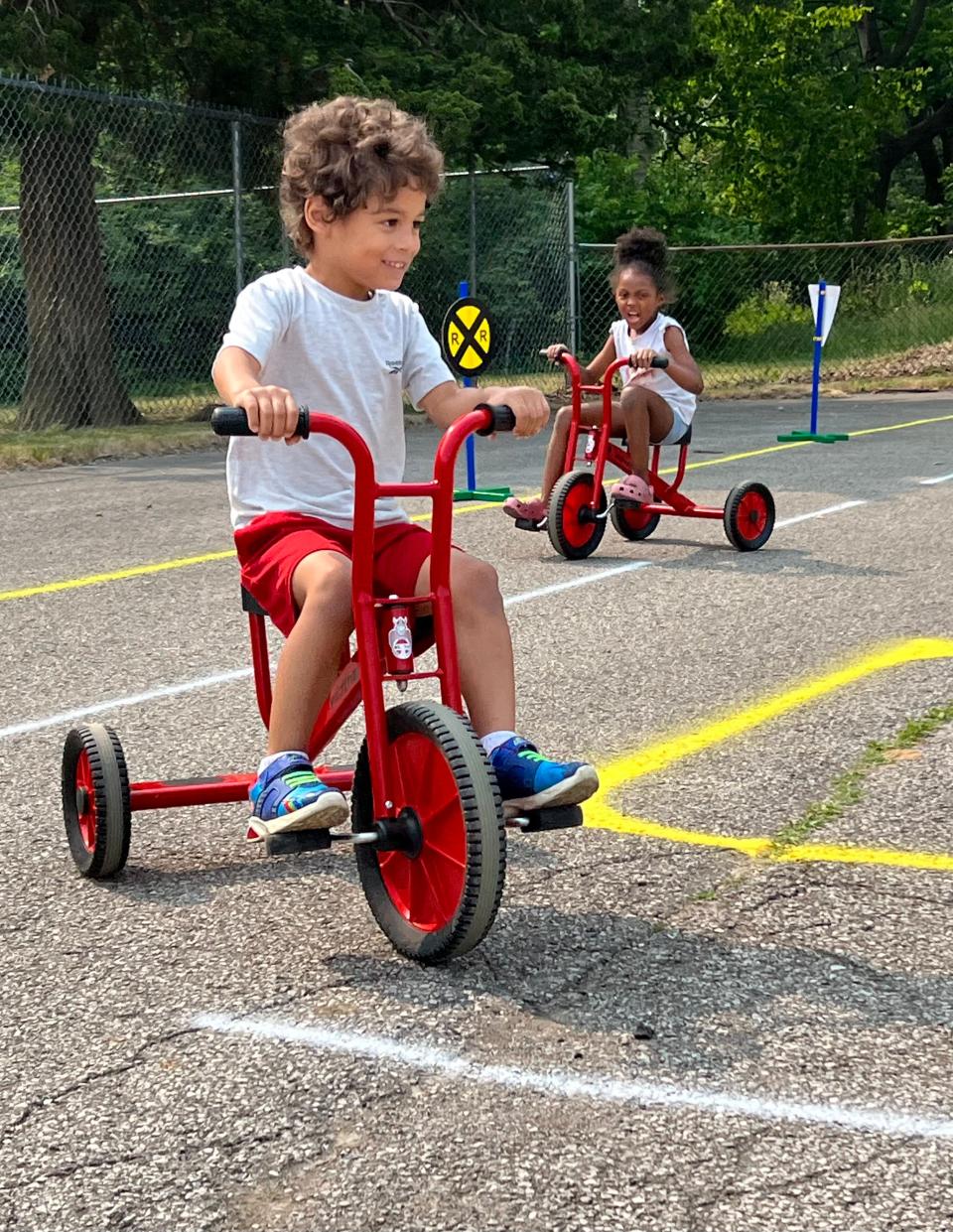 Children leaned about the rules of the road during a special Safety Town held at the YMCA Childcare center in Mansfield. The program was supported by a Summertime Kids grant.