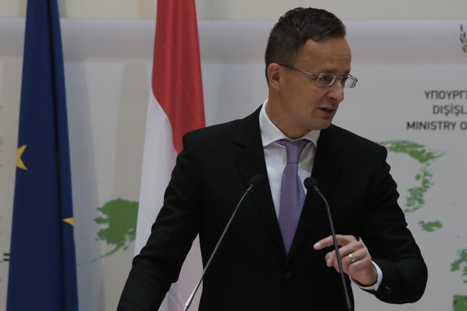 Hungarian Minister of Foreign Affairs and Trade Peter Szijjarto speaks during a news conference after a meeting with Cyprus' Foreign Minister Nikos Christodoulides at the Cypriot foreign ministry on Friday, June 26, 2020. Szijjarto is in Cyprus for one-day visit. (AP Photo/Petros Karadjias)