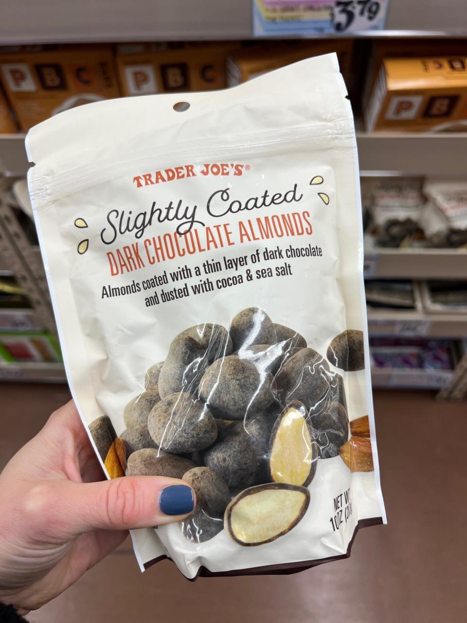 A bag of Slightly Coated Dark Chocolate Almonds: "almonds coated with a thin layer of dark chocolate and dusted with cocoa & sea salt"