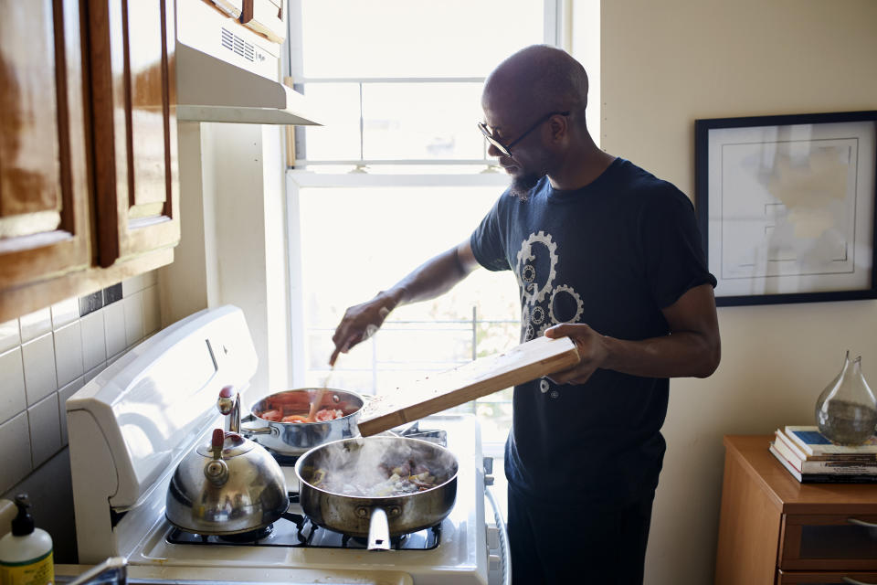 a man at a stove cooking