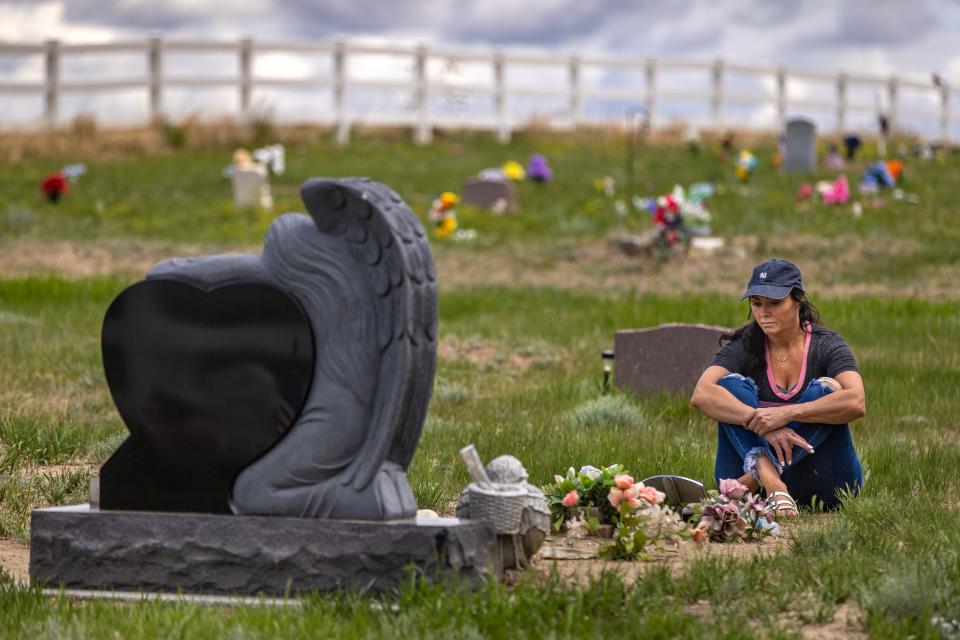 Rhonda Packineau visits the grave of her daughter, Cheyenne, in the Parshall, N.D., Meadows Cemetery. The 21-year-old died of a drug overdose in a Bismarck hotel room in 2018.