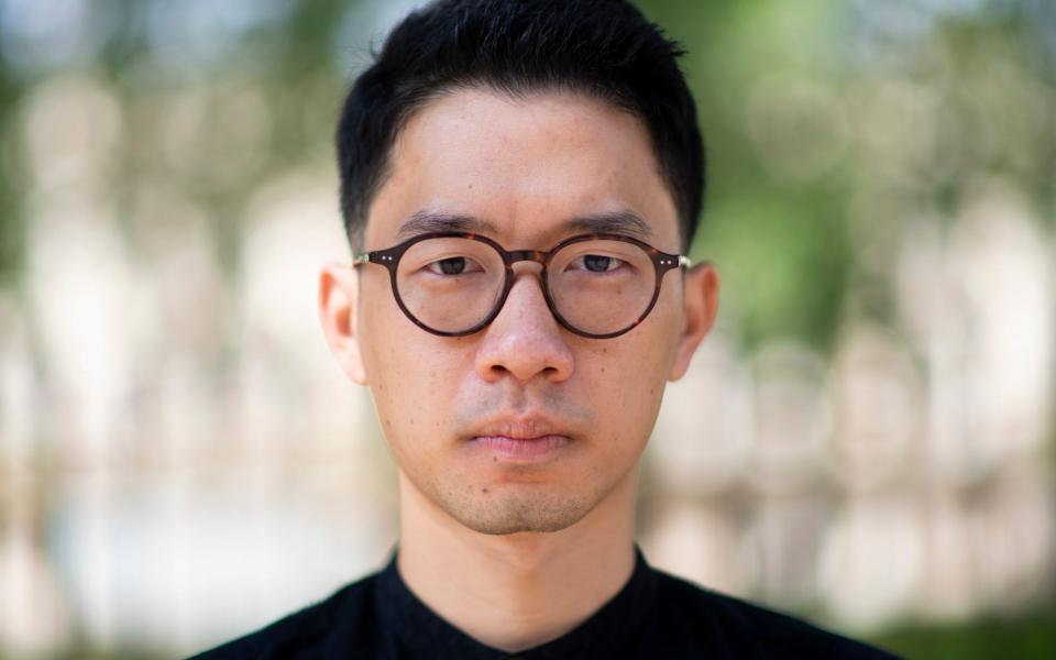 Nathan Law, pictured in London on Friday. He fled Hong Kong earlier this month and is "not optimistic" he will ever see his parents again - Geoff Pugh