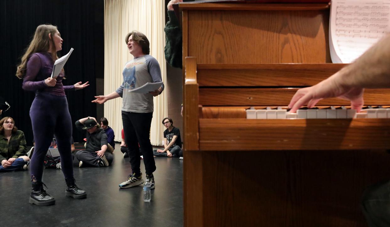 Firestone CLC students Anna Foltz, playing the role of Winnie, and Kyle McFalls, playing Jesse, practice their singing parts during a recent rehearsal for the upcoming "Tuck Everlasting" musical in Akron.