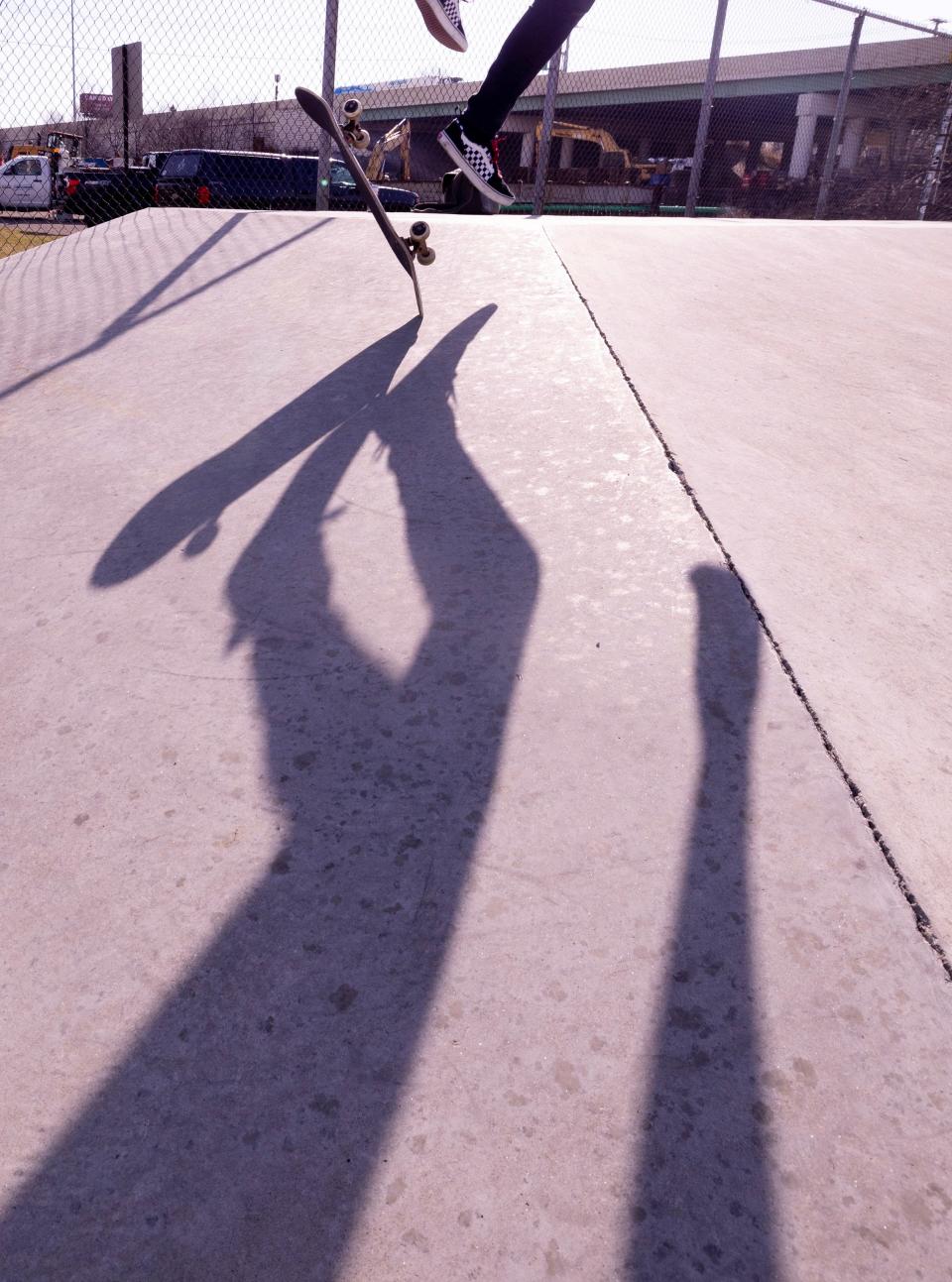 Steven Lagel's shadow is pictured as the Plain Township resident does a backside kick flip at the 9th Street DIY skate park in Canton.