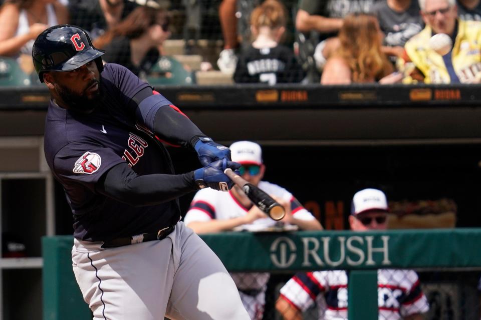 Cleveland Guardians' Franmil Reyes hits a two-run home run during the eighth inning of a baseball game against the Chicago White Sox in Chicago, Sunday, July 24, 2022. (AP Photo/Nam Y. Huh)