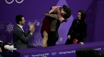 <p>FEBRUARY 20: Tessa Virtue and Scott Moir of Canada celebrate winning the gold medal along their coaches Marie-France Dubreuil and Patrice Lauzon at ‘kiss and cry following the Figure Skating Ice Dance Free Dance program on day eleven of the PyeongChang 2018 Winter Olympic Games at Gangneung Ice Arena on February 20, 2018 in Gangneung, South Korea. (Photo by Jean Catuffe/Getty Images) </p>