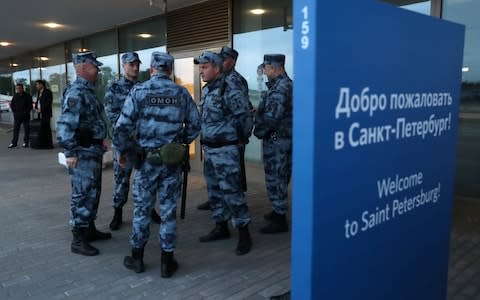 Riot police stand guard at St Petersburg airport, part of a push to increase security during the World Cup - Credit: Alexander Demianchuk/TASS via Getty Images