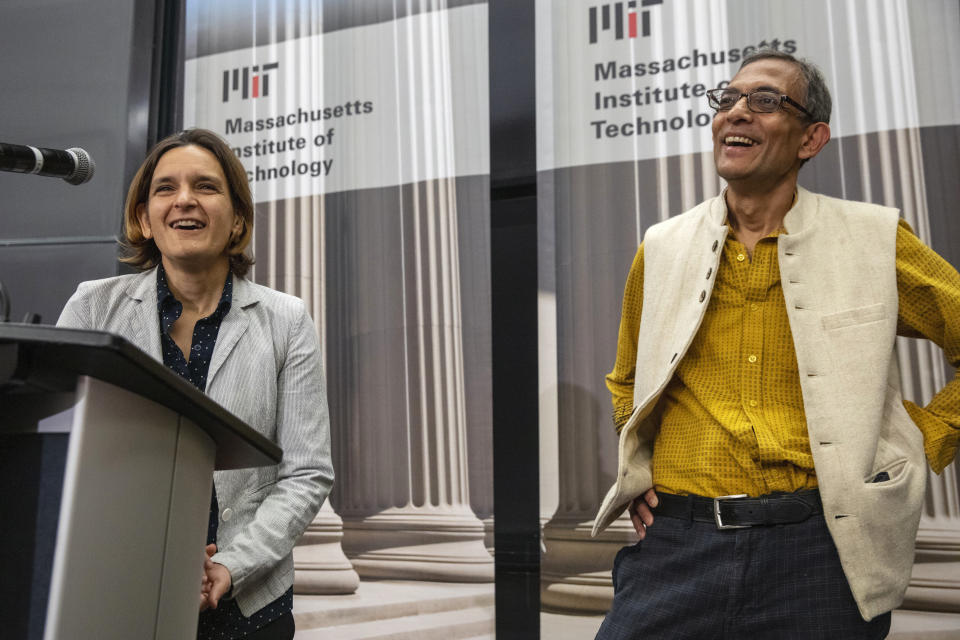 Esther Duflo, left, and Abhijit Banerjee speak during a news conference at Massachusetts Institute of Technology in Cambridge, Mass., Monday, Oct. 14, 2019. Banerjee and Duflo, along with Harvard's Michael Kremer, were awarded the 2019 Nobel Prize in economics for pioneering new ways to alleviate global poverty. (AP Photo/Michael Dwyer)