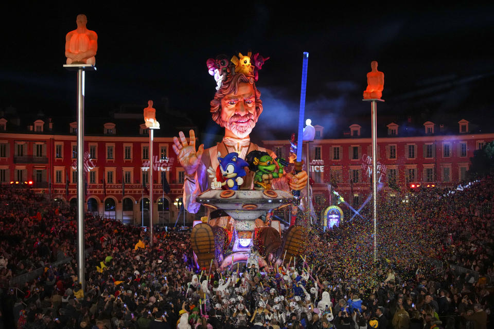 A carnival float depicting a king parades through Place Massena during the opening ceremony of 151st edition of the Nice Carnival in Nice, southern France, Saturday, Feb. 17, 2024. (AP Photo/Daniel Cole)