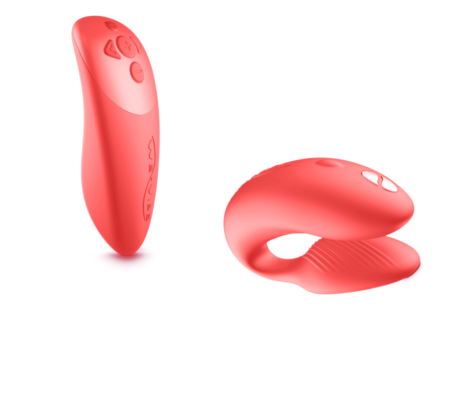 A bright coral silicone remote control for a vibrator toy on the left with the vibrator on the right against a white background.