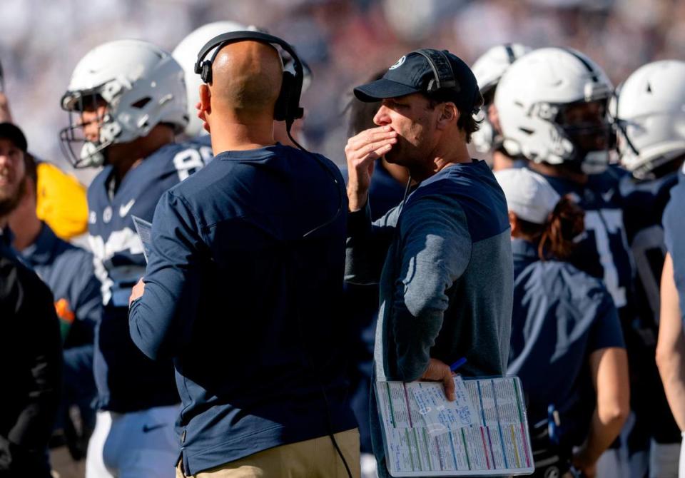 Penn State football coach James Franklin and offensive coordinator Mike Yurcich talk during the game against Ohio State on Saturday, Oct. 29, 2022.