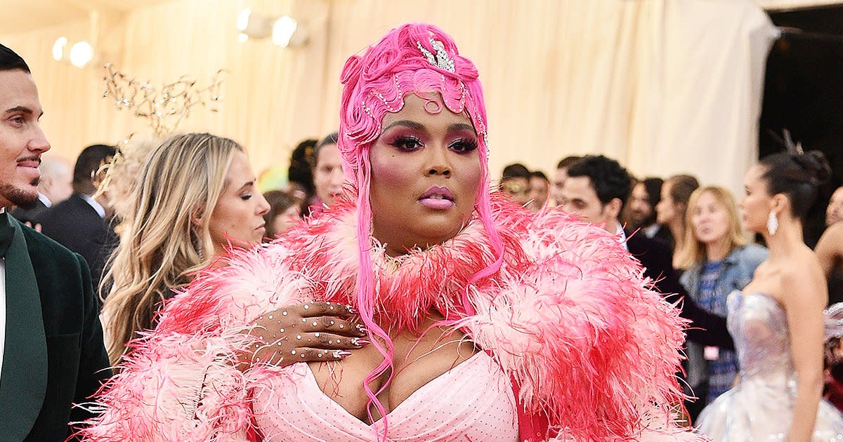 Lizzo Wears Her Feathery Met Gala 'Camp' Cape to the Airport the