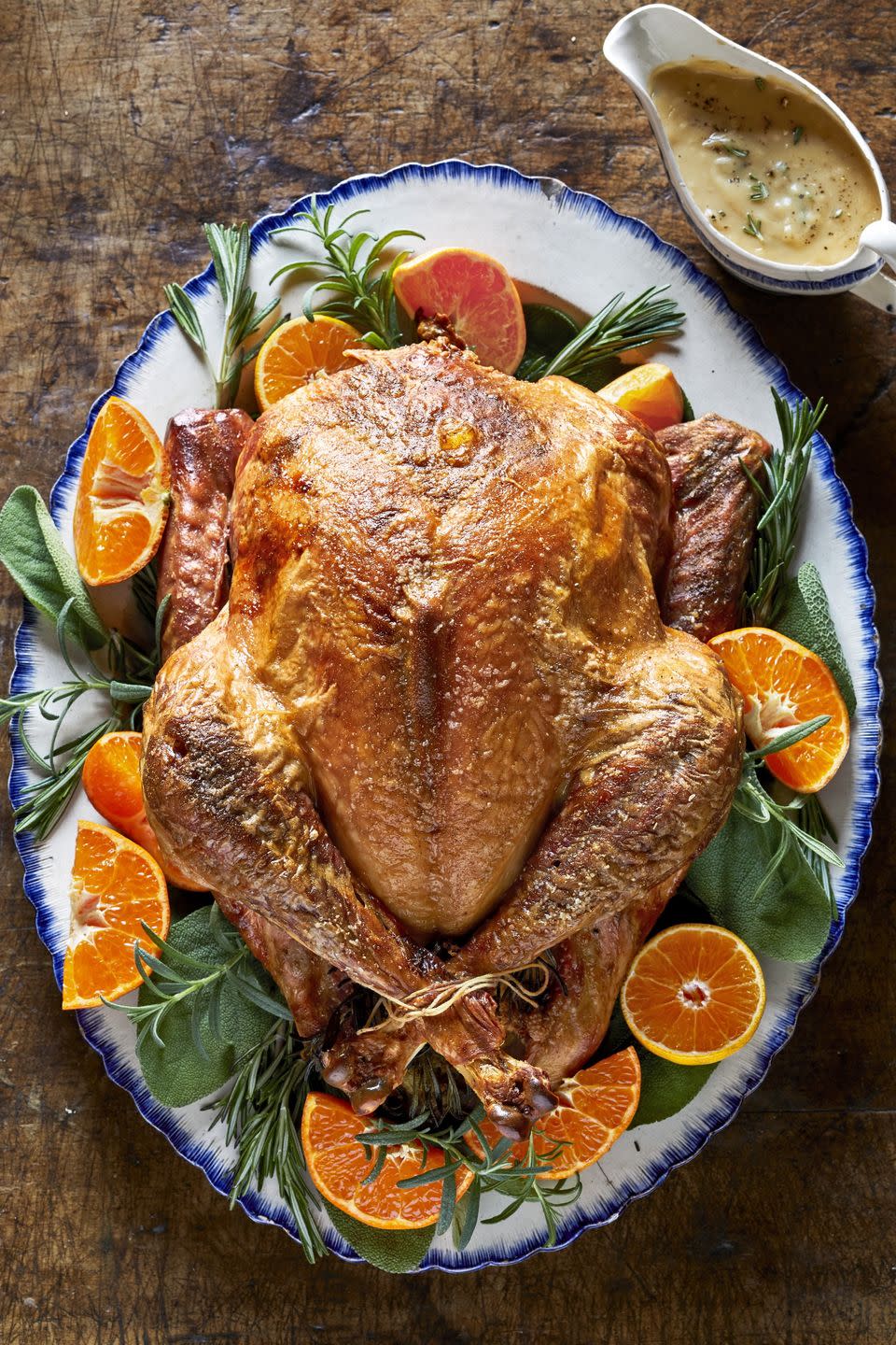 <p>Of course, it all starts with the perfect turkey—and you've definitely found it here. We swap out butter for olive oil, and keep the salt low, but, garnished with clementines and rosemary, this crispy bird is still flavorful. And it's practically an edible <a href="https://www.countryliving.com/entertaining/g2130/thanksgiving-centerpieces/" rel="nofollow noopener" target="_blank" data-ylk="slk:table centerpiece;elm:context_link;itc:0;sec:content-canvas" class="link ">table centerpiece</a>.</p><p><strong><a href="https://www.countryliving.com/food-drinks/a29130091/seasoned-roasted-turkey-recipe/" rel="nofollow noopener" target="_blank" data-ylk="slk:Get the recipe;elm:context_link;itc:0;sec:content-canvas" class="link ">Get the recipe</a>.</strong></p><p><strong><a class="link " href="https://www.amazon.com/dp/B000FDN1RG/?tag=syn-yahoo-20&ascsubtag=%5Bartid%7C10050.g.33370793%5Bsrc%7Cyahoo-us" rel="nofollow noopener" target="_blank" data-ylk="slk:SHOP PLATTERS;elm:context_link;itc:0;sec:content-canvas">SHOP PLATTERS</a><br></strong></p>