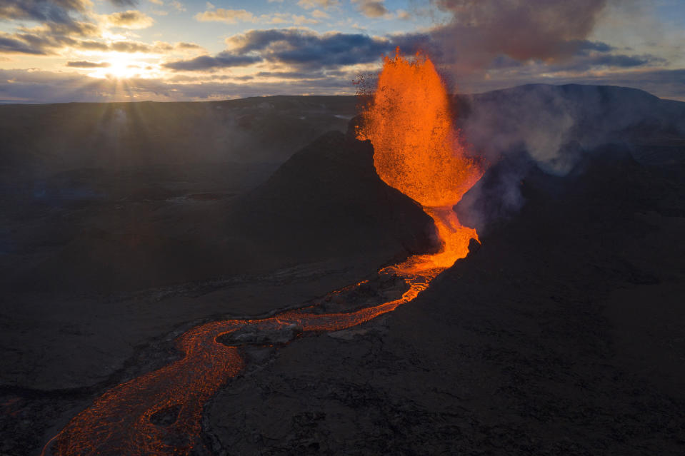 Lava flows from an eruption of the Fagradalsfjall volcano on the Reykjanes Peninsula in southwestern Iceland on Tuesday, May 11, 2021. (AP Photo/Miguel Morenatti)