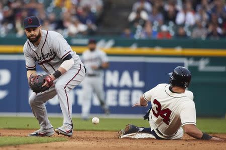 Jun 9, 2018; Detroit, MI, USA; Cleveland Indians second baseman Jason Kipnis (22) miss plays the ball as Detroit Tigers catcher James McCann (34) slides into second safe in the seventh inning at Comerica Park. Mandatory Credit: Rick Osentoski-USA TODAY Sports