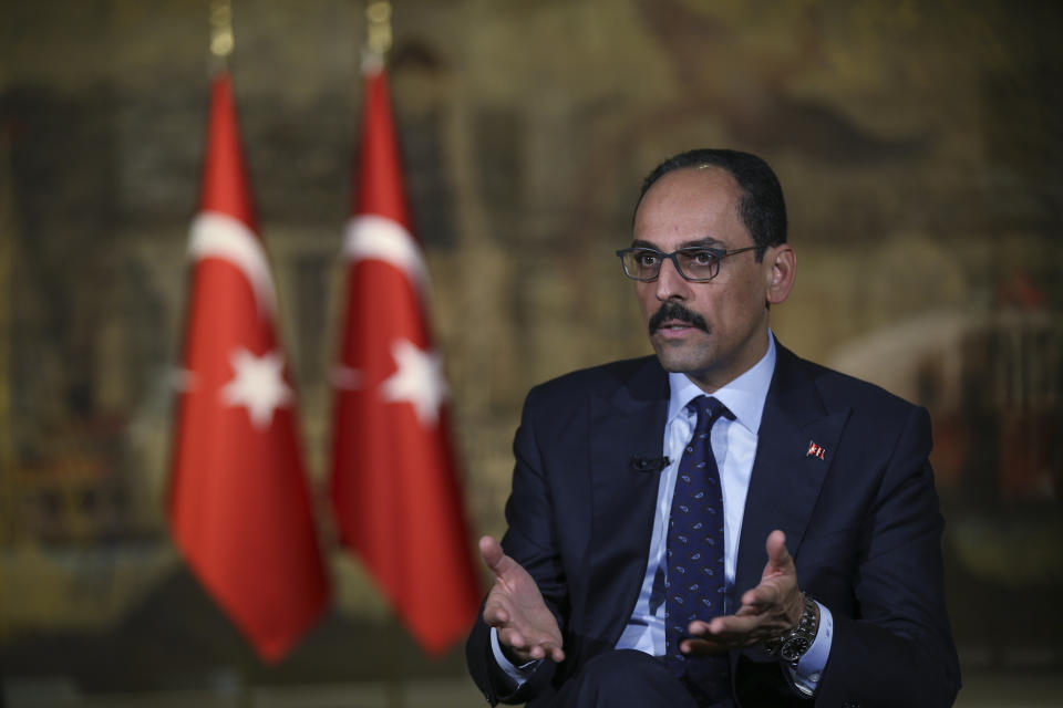 Ibrahim Kalin, chief advisor to Turkey's President Recep Tayyip Erdogan, speaks during an interview in Istanbul, Saturday, Oct. 19, 2019. Erdogan wants Syrian government forces to move out of areas near the Turkish border so it can resettle up to 2 million refugees there, Kalin said, adding that Erdogan will raise the issue in talks next week with Syria's ally, Russian President Vladimir Putin. Government troops have moved in to several locations in northeastern Syria this week, invited by Kurdish-led fighters to protect them from Turkey's invasion. (AP Photo/Emrah Gurel)