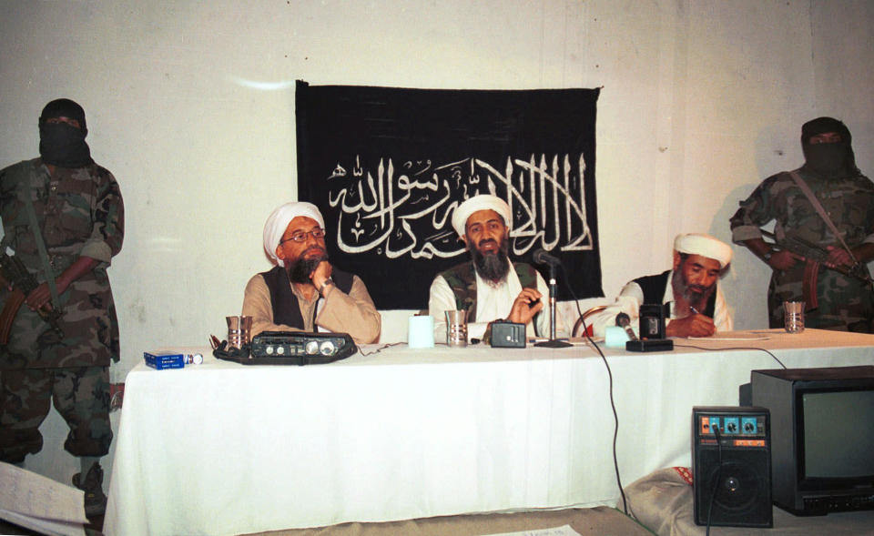 FILE - In this 1998 file photo, Ayman al-Zawahri, center left, and Osama bin Laden, center, hold a news conference in Afghanistan. Born out of the 1980s war against the Soviet Union's occupation of Afghanistan, the terror group al-Qaida under bin Laden grew into a generational threat to America that culminated in its Sept. 11, 2001, attack that brought down the World Trade Center in New York. (AP Photo/File)