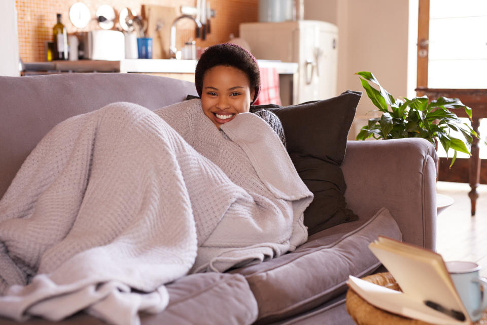 Shot of a young woman relaxing at home on the weekend 