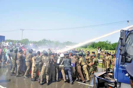 Police clash with demonstrators during a protest against the launching of a Chinese industrial zone by China Merchants Port Holdings Company, in Mirijjawila, Sri Lanka January 7, 2017. REUTERS/Stringer