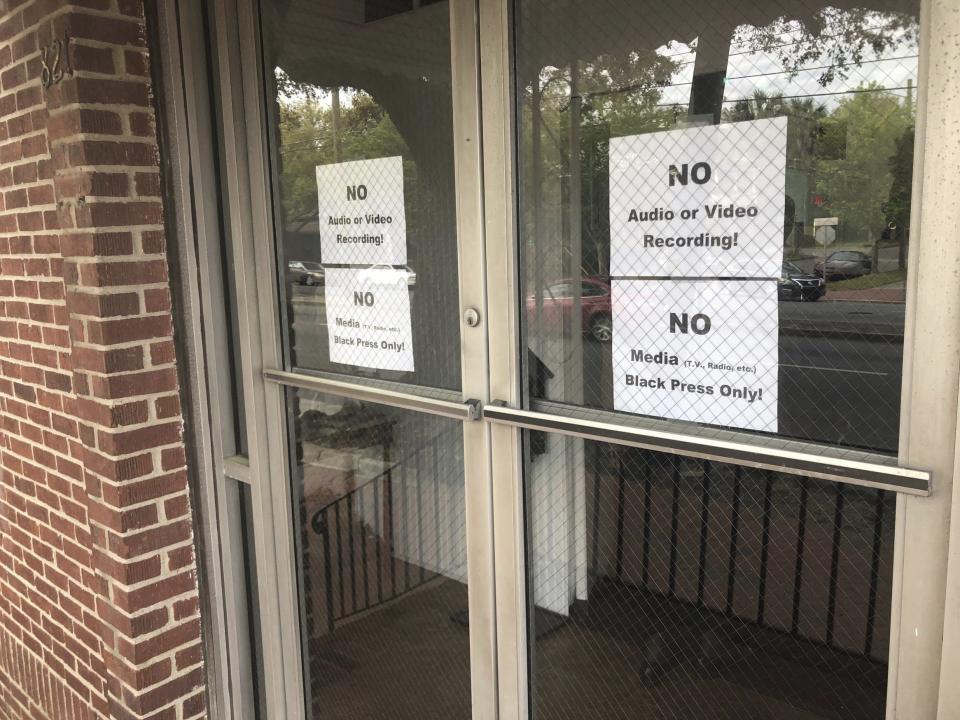 This Wednesday, March 28, 2019 photo shows signs on the doors of the Bolton Street Baptist Church before a meeting to discuss an upcoming mayoral race in Savannah, Ga. Organizers of the meeting to discuss an upcoming mayoral race in Georgia barred reporters from attending, unless they were African-American. News outlets report the Wednesday meeting at the church in Savannah was held to try to unite the city’s black community behind a single candidate for mayor. (Eric Curl/Savannah Morning News via AP)