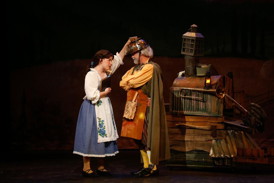 Belle (Hayden Gish) tapes the head of her father Maurice (Dennis Roberts) during Springfield Little Theatre's preview of "Beauty and the Beast" at The Landers Theatre on Thursday, June 8, 2023. The production closes out Springfield Little Theatre's 88th season and will run June 9-25, 2023.d News-Leader