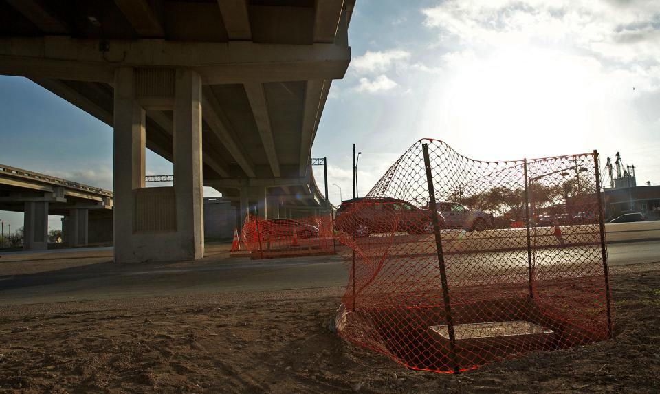 Traffic moves past a road construction work zone on N. Bryant Blvd. on Tuesday, April 6, 2021.