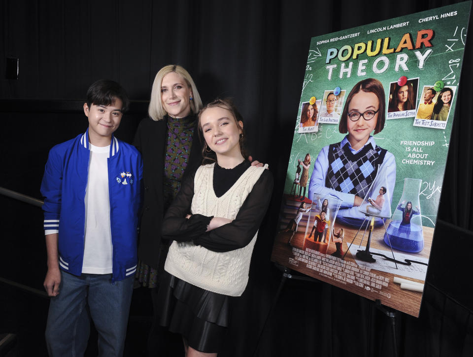 SANTA MONICA, CALIFORNIA - FEBRUARY 9:  Lincoln Lambert, Ali Scher and Sophia Reid-Gantzert attend the 