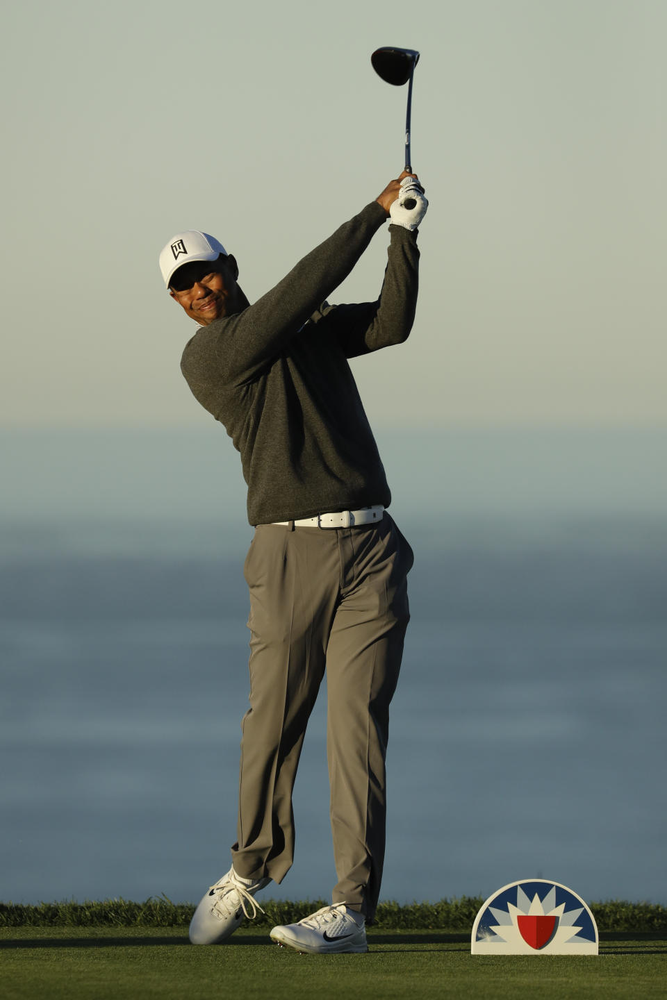 Tiger Woods watches his tee shot on the fourth hole during the pro-am round of the Farmer's Insurance Open golf tournament on the North Course at Torrey Pines Golf Course on Wednesday, Jan. 23, 2019, in San Diego, Calif. (AP Photo/Chris Carlson)