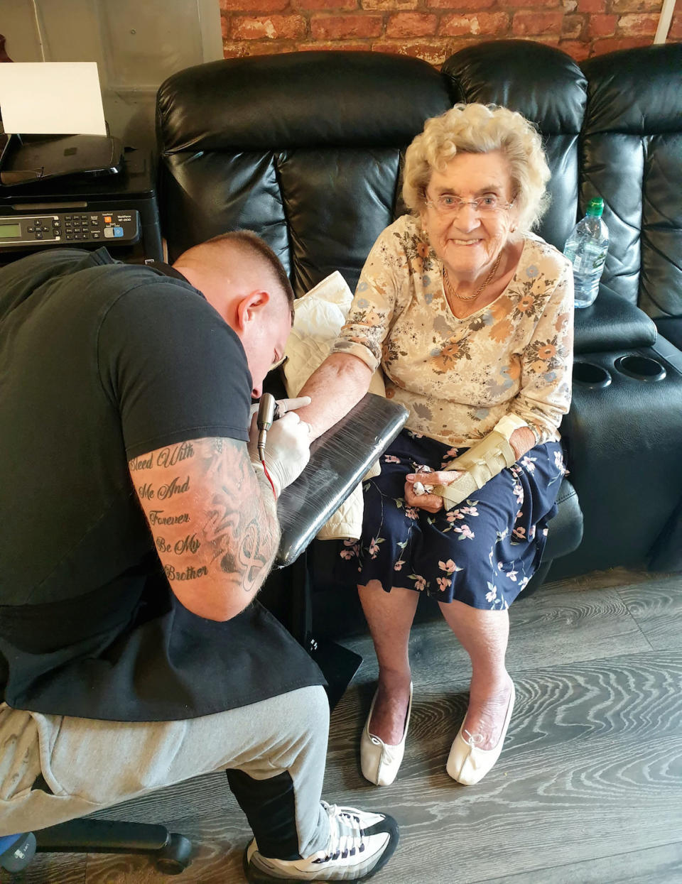 Hilda West having a tattoo done by tattoo artist Matty Gardner (Picture: SWNS)