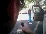 Keith Scott looks over to police with hands by his sides just before he was shot four times by Charlotte police in Charlotte, North Carolina, U.S. in this September 20, 2016 still image from video released by Charlotte police. Charlotte-Mecklenburg Police Department/Handout via Reuters