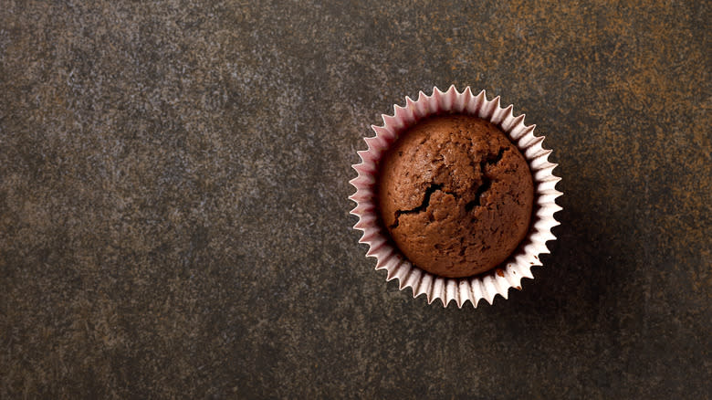 chocolate muffin on surface