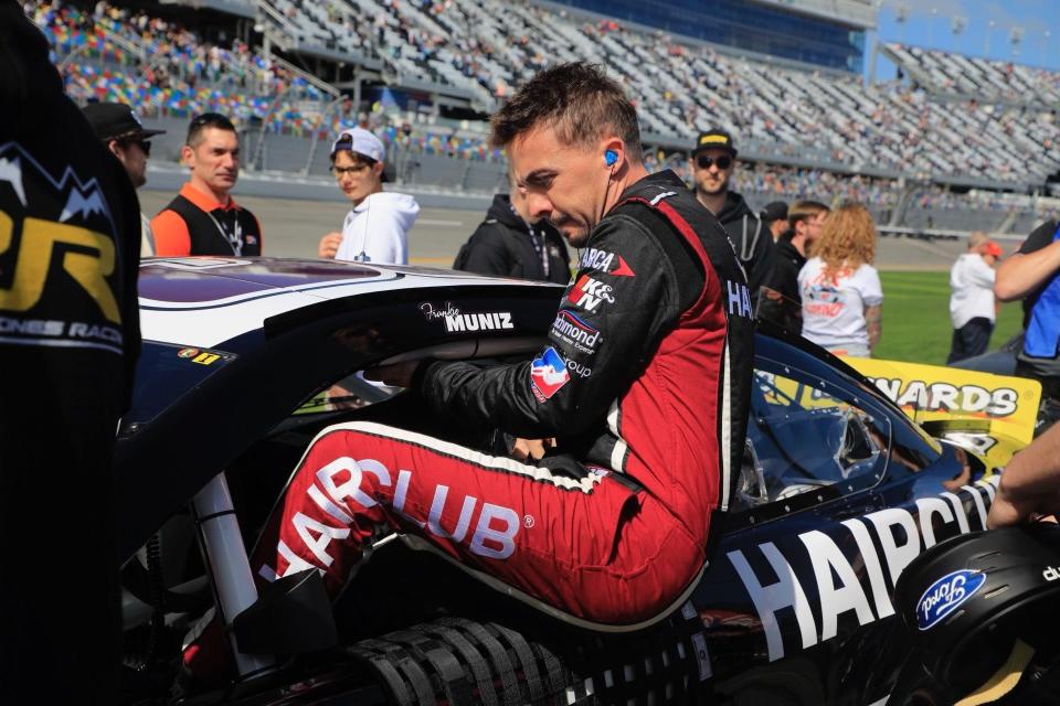 Frankie Muniz climbs into his car before the start of the ARCA Menards Series 200 on Saturday afternoon at Daytona International Speedway.