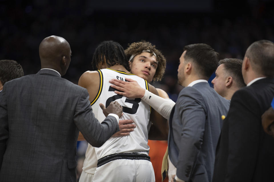 Missouri forward Noah Carter, rear, embraces forward Aidan Shaw (23) after the team's loss to Princeton during a second-round college basketball game in the men's NCAA Tournament, Saturday, March 18, 2023, in Sacramento, Calif. Princeton won 78-63. (AP Photo/José Luis Villegas)