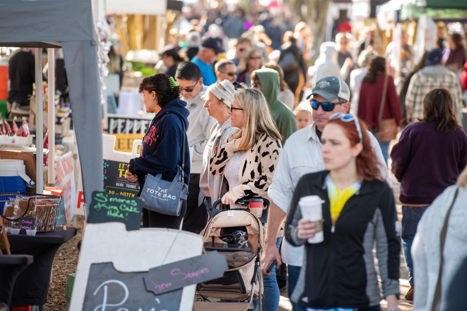 Shoppers check out the vendors at the Palafox Market Saturday, January 28, 2023 in Downtown Penscaola.