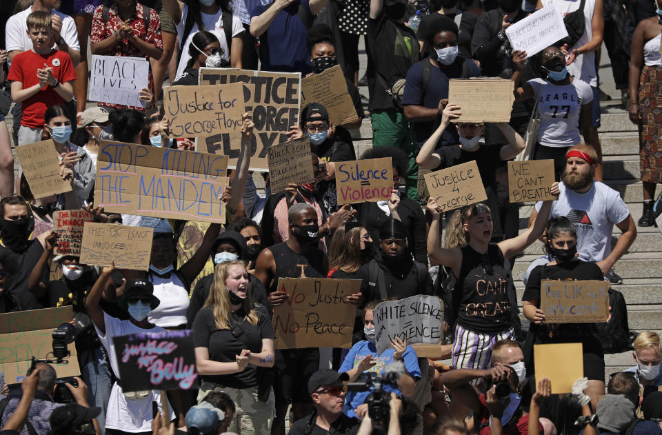 People gather in Trafalgar Square in central London on Sunday, May 31, 2020 to protest against the recent killing of George Floyd by police officers in Minneapolis that has led to protests across the US. (AP Photo/Matt Dunham)