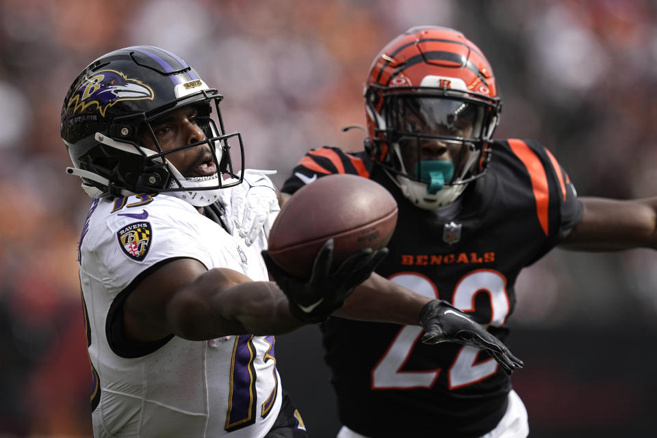 Baltimore Ravens wide receiver Devin Duvernay, left, is unable to catch a pass as Cincinnati Bengals cornerback Chidobe Awuzie (22) defends during the second half of an NFL football game Sunday, Sept. 17, 2023, in Cincinnati. (AP Photo/Darron Cummings)