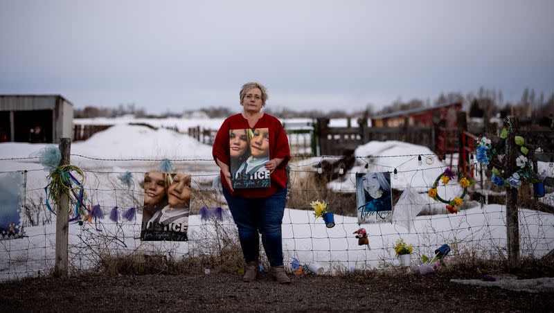 Peggy Jeppesen poses for a photo beside a memorial for Tylee Ryan and JJ Vallow, which she helped set up across the street from Chad Daybell’s property, in Salem, Idaho, on Wednesday, March 29, 2023.