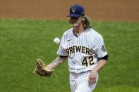 Milwaukee Brewers relief pitcher Josh Hader reacts after walking in a second run with bases loaded during the ninth inning of a baseball game against the Pittsburgh Pirates Saturday, Aug. 29, 2020, in Milwaukee. (AP Photo/Morry Gash)