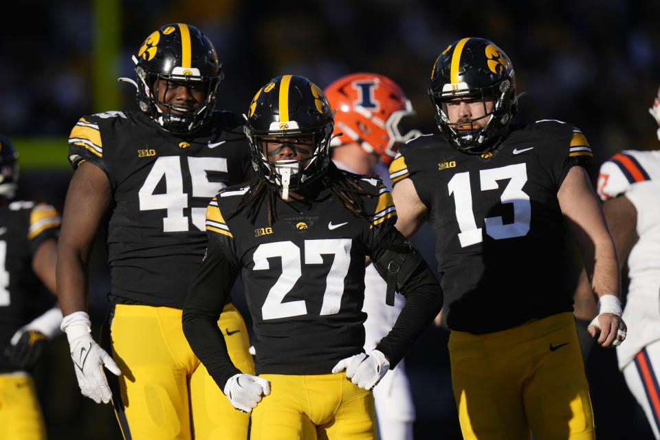 Iowa defensive back Jermari Harris (27) celebrates after making tackle during the first half of an NCAA college football game against Illinois, Saturday, Nov. 18, 2023, in Iowa City, Iowa. (AP Photo/Charlie Neibergall)